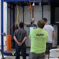 Students watching a demonstration of safety lines